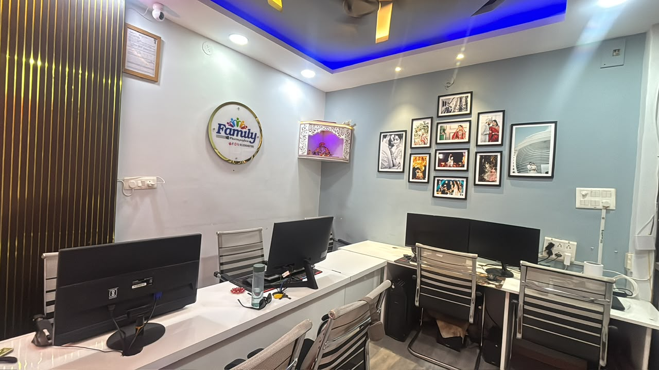 Family Photographer studio interior with logo sign and editing desks in Indore